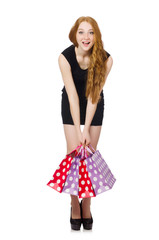 Woman with shopping bags isolated on white