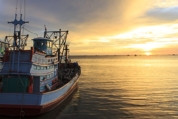 Fototapeta na wymiar Fishing boat on the beach when sunset