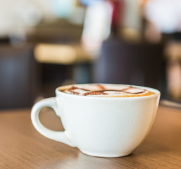 Coffee cup in coffee shop interior