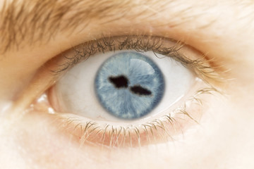 Close-up of an eye with the pupil in the shape of Samoa.(series)