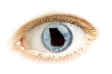 Close-up of an eye with the pupil in the shape of Georgia.(serie