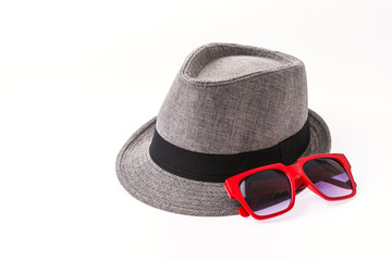 Hat , sunglasses isolated on white