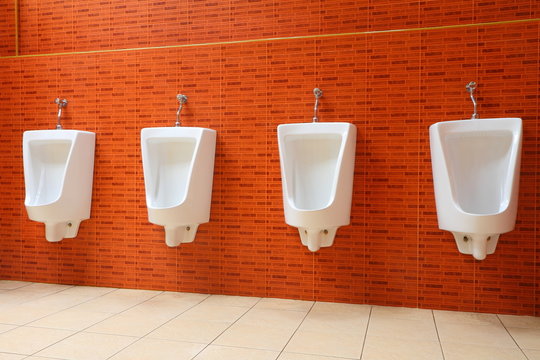 White porcelain urinals in gents toilets