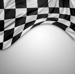 Checkered flag on plain background. Copy space