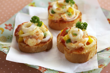 close up spicy seafood pizza on paper