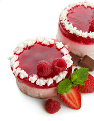 Delicious berry cakes isolated on white