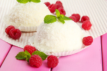 Delicious coconut cakes on table close-up