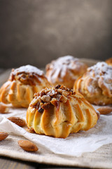 Tasty cakes on table on grey background