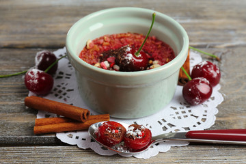 Tasty cherry dessert on table
