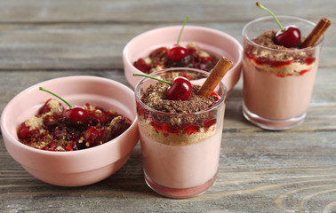 Tasty cherry dessert on table