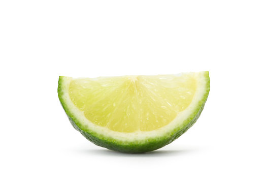 slice of lime over white background