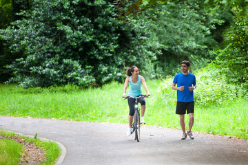 Young sportive couple jogging at the park