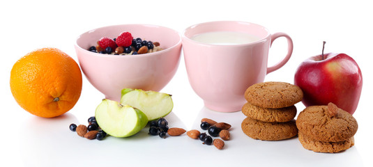 Healthy oatmeal in bowl with berries and fruits, isolated