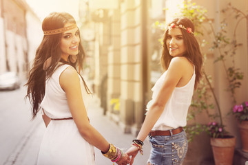 The best female boho girls walking in city © gpointstudio