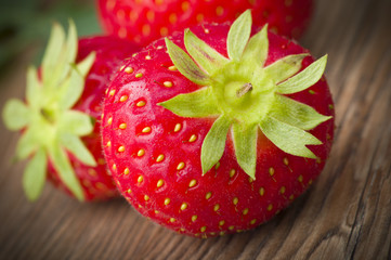 Fresh Strawberry close up on the wood
