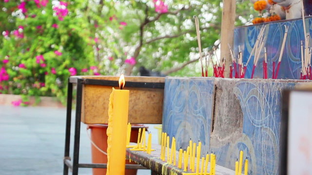 candles and smoking prayer sticks