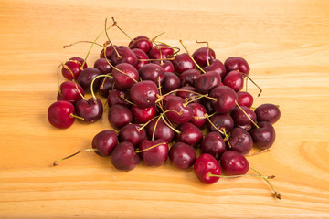 Sweet Red Cherries on a Wood Table