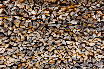 The Background of stack of old firewood