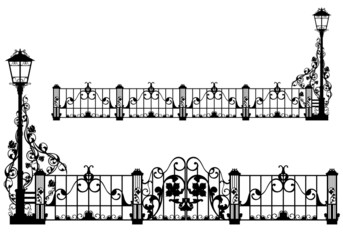 beautiful iron fence with street light and gates