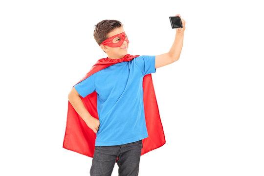 Boy in superhero costume taking a selfie