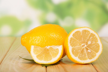 Fototapeta na wymiar Sliced lemon closeup on table in yard