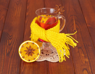 scarf tied round a cup of mulled wine