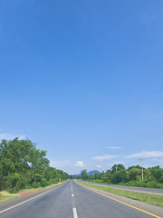 Local highway under blue sky