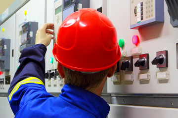 Worker in a helmet, the electrician