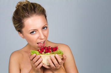 Woman holding raspberries