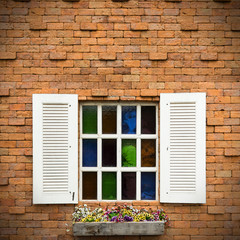 Open Window With Flower Basket On Brick  Wall