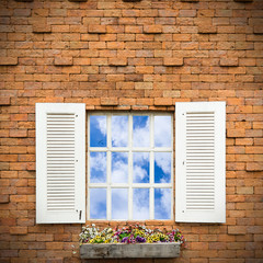 Open Window With Flower Basket On Brick  Wall