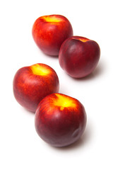 .Nectarines isolated on a white studio background.