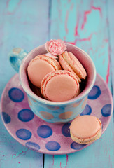 Vanilla macaroon in colorful cup