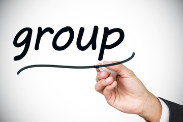 Businessman writing the word group