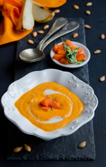 Pumpkin soup on the black background