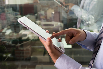 Asian businessman using tablet