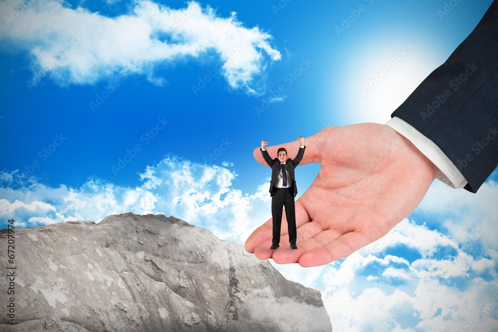Poster Composite image of businessman cheering at the camera in large h