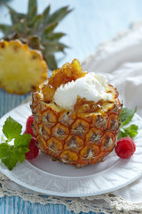 Fruit sorbet ice cream in small pineapple