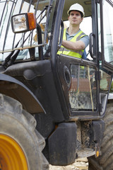 Construction Worker Driving Digger