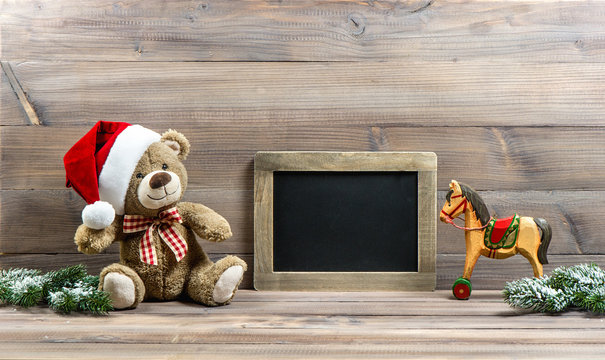 christmas decoration with antique toys teddy bear and rocking ho