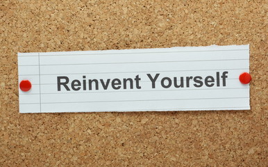 The phrase Reinvent Yourself on a cork notice board