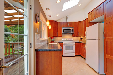 Bright kitchen room with skylight and walkout deck