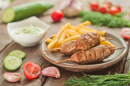 Cevapcici with tzatziki. The traditional Balkan dish