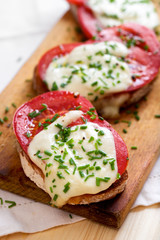 Bruschetta with fresh tomato, mozzarella cheese  and chive