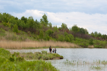 Obraz na płótnie Canvas Family fishing on a lake
