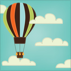 Vintage or retro hot air balloon in sky with clouds
