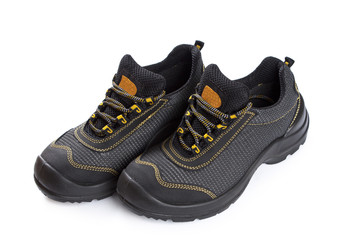 Black working boots with yellow thread on white