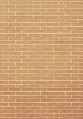 Closeup of orange yellow brick wall as background or texture