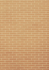 Closeup of orange yellow brick wall as background or texture