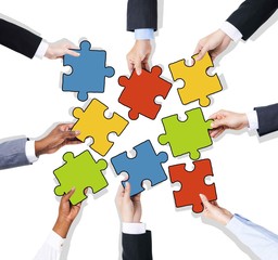 Group of Hands with Jigsaw Puzzle